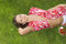 Free Pretty Girl Relaxing On Green Grass And Eat Red Fr Stock Photography - 5217392