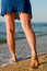 Free Legs In Blue Skirt Standing In Sea Surf Stock Images - 5249524
