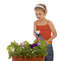 Free Young Girl Watering A Flower Stock Image - 5259701