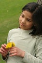 Free Girl Holding Dandelions With Sad Expression Stock Photo - 5309210