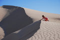 Free Young Girl Playing On Sand Dunes Stock Photos - 5358273