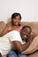 Free Happy Couple Smiling On A Couch-Vertical Royalty Free Stock Photo - 5413155
