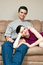 Free Happy Couple Sitting On A Couch - Vertical Royalty Free Stock Photos - 5433398