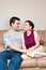 Free Happy Couple Hugging On A Couch - Vertical Royalty Free Stock Image - 5434036