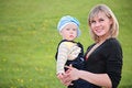 Free Mother Hold Baby On Grass Stock Photo - 5462450
