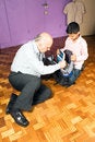 Free Grandfather And Grandson On The Floor - Vertical Stock Image - 5479041