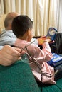 Free Grandfather And Grandson Sitting On Couch Playing Royalty Free Stock Photo - 5479245