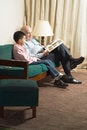 Free Grandfather And Grandson On Couch Reading Royalty Free Stock Images - 5479639