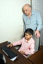 Free Grandfather And Grandson Sit By The Computer Stock Image - 5479651