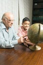 Free Grandfather And Grandson Sitting At The Table Royalty Free Stock Photos - 5479758