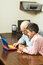 Free Grandfather And Grandson Looking At A Toy Computer Royalty Free Stock Photography - 5479967