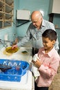 Free Grandfather And Grandson Washing Dishes - Vertical Royalty Free Stock Photography - 5480147
