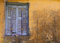 Free Blue Window Shuttered On Yellow Wall. Stock Photo - 5516380
