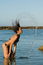 Free Woman Playing With Her Hair In The Sea Stock Image - 5553331