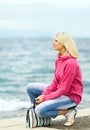 Free Woman Sitting Near The Ocean Stock Photos - 5631533