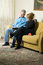 Free Couple Reading A Book On A Couch-Vertical Royalty Free Stock Image - 5640546