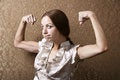 Free Young Woman Flexing Her Biceps Royalty Free Stock Photo - 5717855