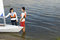 Free Couple Next To Sailboat On Water - Horizontal Stock Photo - 5842460