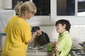 Free Woman Pouring Boy Drink - Horizontal Stock Image - 5850261