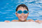 Free Boy Swimming In The Pool With Goggles Royalty Free Stock Photography - 5856657