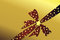 Free Red Bow With Golden Stars On Golden Background Stock Photography - 6034542