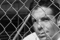 Free Man Behind A Fence Stock Images - 6094784