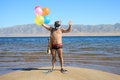 Free Man With Mask, Flippers And Balloons Is Salutation Stock Image - 6195901