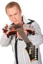 Free Man Keeps Guitar And Looks At It Stock Image - 6371751