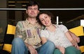 Free Couple Sit On Sofa In Dark Hall Stock Image - 6374761