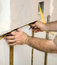 Free Electrician Wiring The Walls Stock Image - 6417291