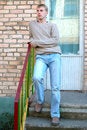 Free Young Stylish Man Stay On Stairs Near Brick Wall. Royalty Free Stock Photos - 6558238