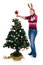 Free Happy Girl Decorating Christmas Tree Stock Photography - 6570962