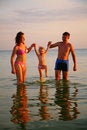 Free Parents Hold Daughter For Hands In Sea Royalty Free Stock Photography - 6582437