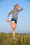 Free Athletics Young Woman Stretching In A Hilly Meadow Royalty Free Stock Images - 6600669