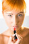 Free Woman Applying Lipstick Stock Image - 6649631
