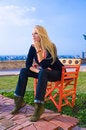 Free Beautiful Blondy Sitting On Red Chair  In Sun Stock Photography - 6841812