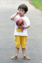 Free Kid Holding A Ball. Stock Photo - 713100