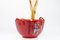 Free Pouring Tea Into Red Teacup Stock Photo - 7930680