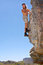 Free Young Rock Climber Looks Down From Rock Royalty Free Stock Image - 8059646