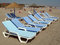 Free Beach Chairs And Umbrellas Stock Images - 816534