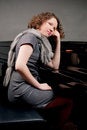 Free Cute Dark Haired Lady Near Piano Royalty Free Stock Photos - 8107538