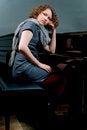 Free Cute Dark Haired Lady Sitting Near Piano Stock Images - 8107564