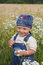 Free The Kid And Camomiles Stock Photography - 8169472