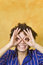 Free Man Smiling With Hand Over Eyes Royalty Free Stock Photo - 8170845