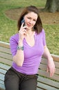 Free Pretty Girl On Park Bench Talking Cell Phone Stock Image - 8229161