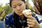 Free Asian Woman With White Rose, Looking At Rose Stock Images - 8403074