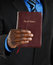 Free Business Man Holding A Bible Royalty Free Stock Images - 8431589