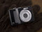 Free Point & Shoot Digital Camera On Leather Gloves Stock Images - 8569874