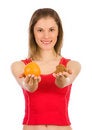 Free Girl Comparing Orange With Chocolates Stock Image - 8607771