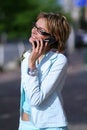 Free Young Woman Walking On The Street And Talking On The Phone Stock Image - 879291